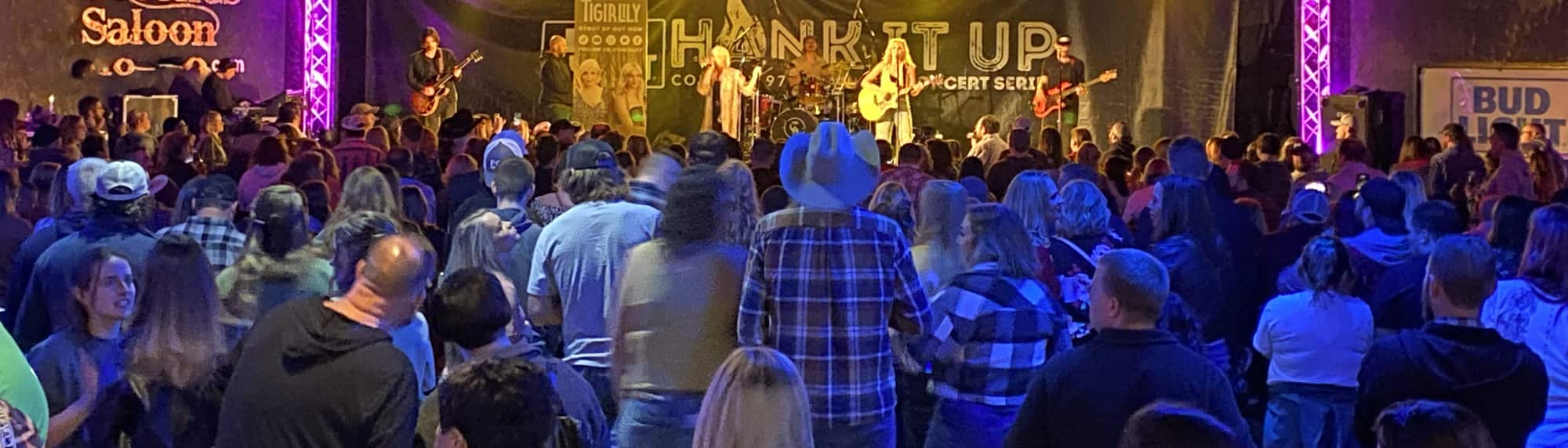 country concert with fans wearing cowboy hats Des Moines