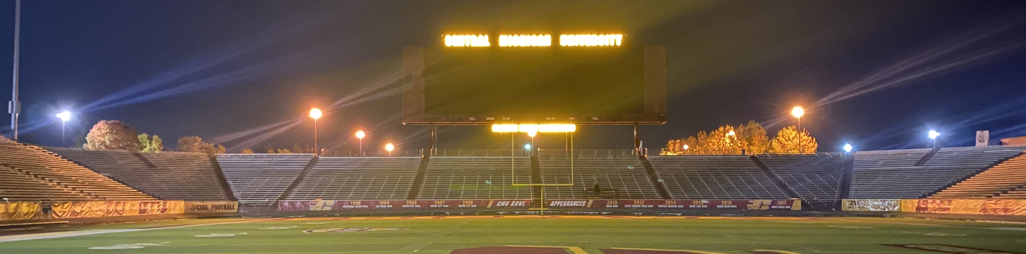 empty football stadium at night under the lights Des Moines
